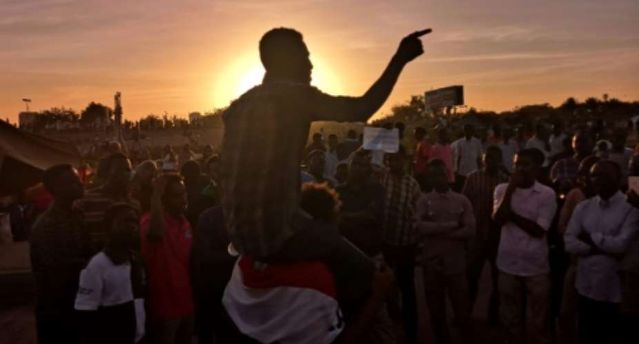 Protesters have been camped for several weeks in front of important government buildings throughout Sudan.  By Ashraf SHAZLY AFP