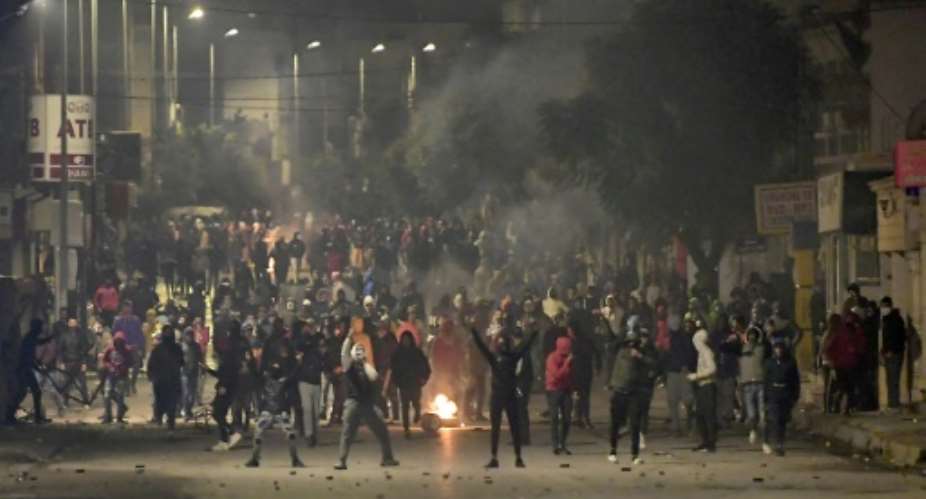 Protesters in Tunisia clashed with police in the Ettadhamen suburb of Tunis on Tuesday night.  By FETHI BELAID AFP