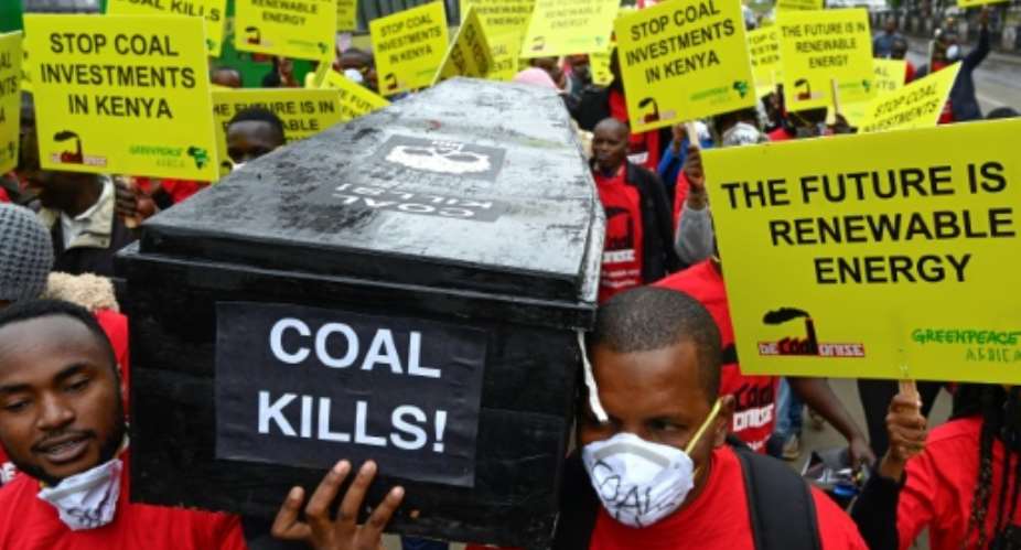 Protesters march in downtown Nairobi to demonstrate against a coal-fired power station planned for Kenya's heritage-listed Lamu archipelago.  By SIMON MAINA AFP