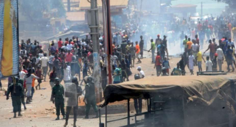 Protestors clashed with anti-riot police in Conakry on Monday -- demonstrations against Guinean President Alpha Conde have unfolded almost daily since disputed elections on February 4.  By CELLOU BINANI AFP