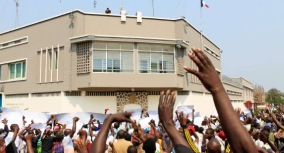 Protestors demonstrate in front of France's embassy against a United Nations UN Security Council decision to send a police contingent to the violence-wracked country on July 30, 2016 in Bujumbura.  By STR AFPFile