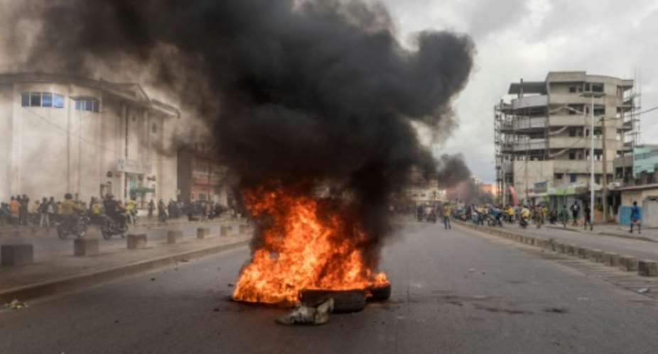 Protestors in Benin set up burning barricades on the streets.  By Yanick Folly AFP