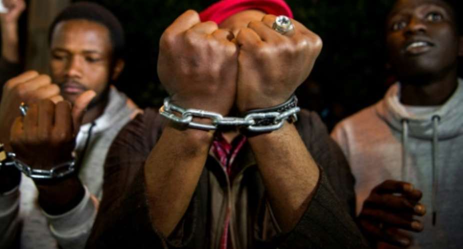 Protests against slavery in Libya have been held outside the Libyan embassy in the Moroccan capital Rabat, after revelations that migrants were being sold as slaves in the country.  By FADEL SENNA AFPFile