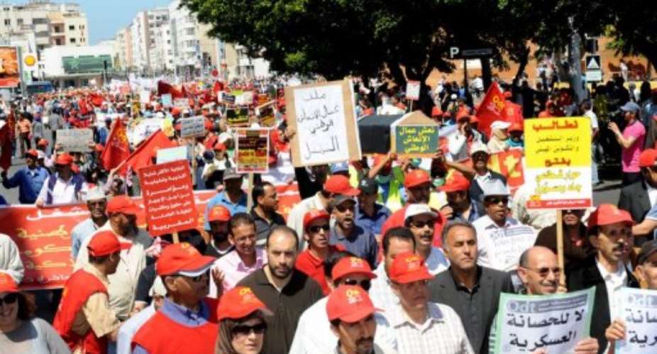 People attend a demonstration organized by trade unions to protest against the Moroccan government in Rabat in June 2012.  By Abdelhak Senna AFPFile