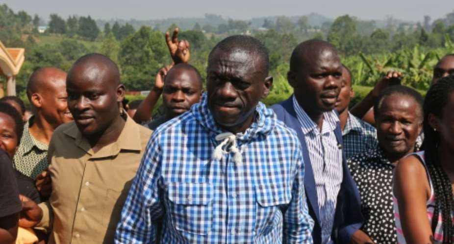 Kizza Besigye centre, who has rejected President Yoweri Museveni's February 18 election victory, said he was trying to attend a prayer meeting at his Forum for Democratic Change FDC party headquarters.  By  AFPFile