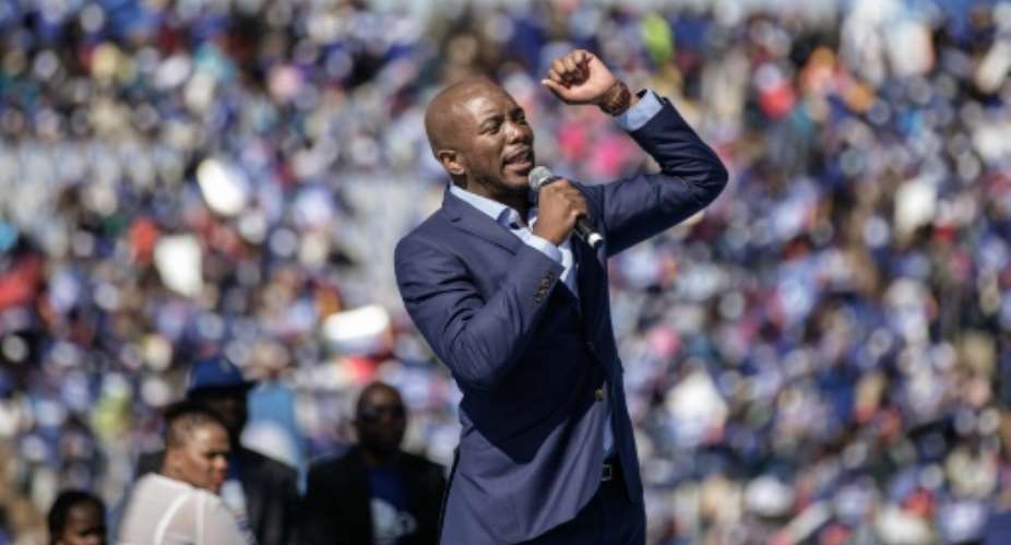 South African opposition leader Mmusi Maimane, of the Democratic Alliance, speaks at a rally at Dobsonville Stadium in Soweto, on July 30, 2016.  By Gianluigi Guercia AFP