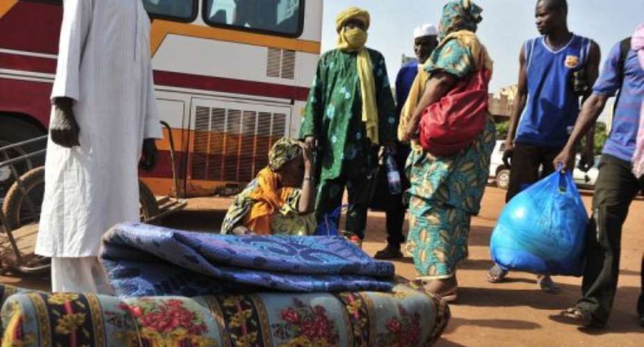 Malian nationals arrive from the northern city of Gao in April 2012 at the Bamako bus station after two days of travel.  By Issouf Sanogo AFPFile