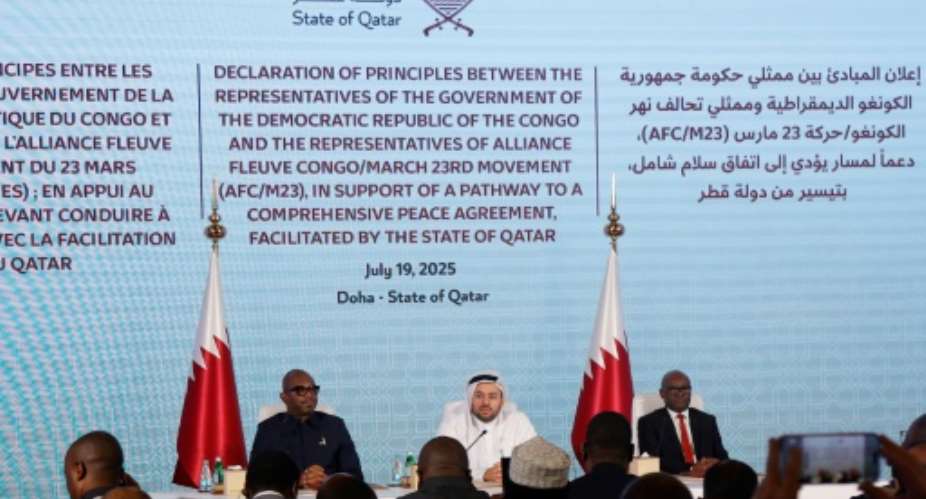 Qatars junior foreign minister Mohamed Bin Mubarak Al-Khulaifi sits in the centre as the Democratic Republic of Congo and Rwanda-backed armed group M23 sign a ceasefire deal.  By Karim JAAFAR (AFP)