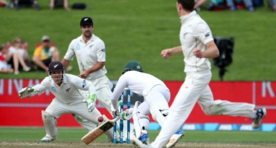 Quinton de Kock of South Africa dives for the crease on day two of the third Test against New Zealand at Seddon Park in Hamilton.  By Fiona Goodall AFP