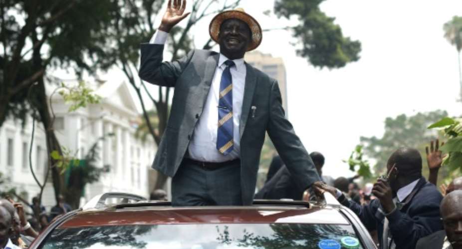 Raila Odinga waves at supporters after the landmark Supreme Court ruling scrapping last month's presidential election.  By SIMON MAINA AFPFile