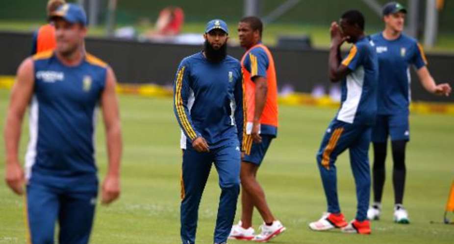 South Africa captain Hashim Amla C warms up with his teammates during the fourth day of the second Test against West Indies at St George's Park in Port Elizabeth on December 29, 2014.  By Marco Longari AFP