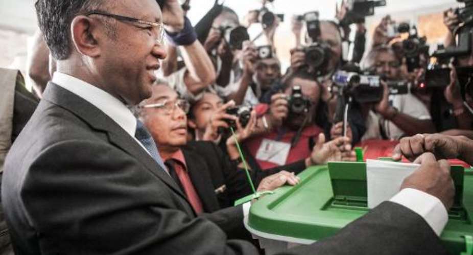 Hery Rajaonarimampianina casts his ballot in a polling station in Antananarivo on December 20, 2013 during the presidential election.  By Rijasolo AFPFile