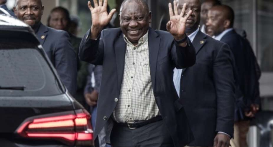 Ramaphosa waves after a meeting of the ANC's paramount body, the National Executive Committee, in Johannesburg on Monday.  By Marco Longari AFP