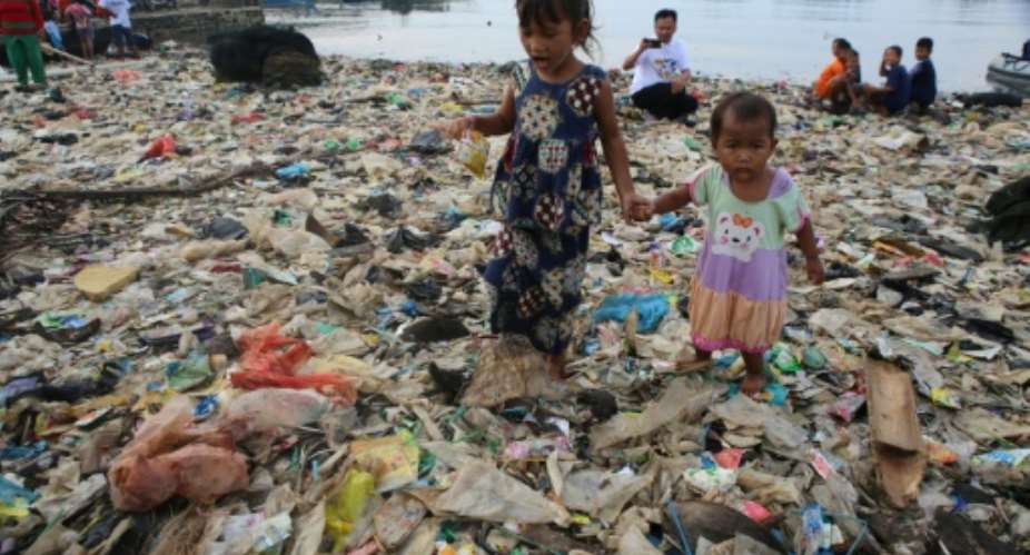 Rampant overconsumption, pollution and food waste in the developed world leads to hunger, poverty and disease elsewhere.  By PERDIANSYAH AFP