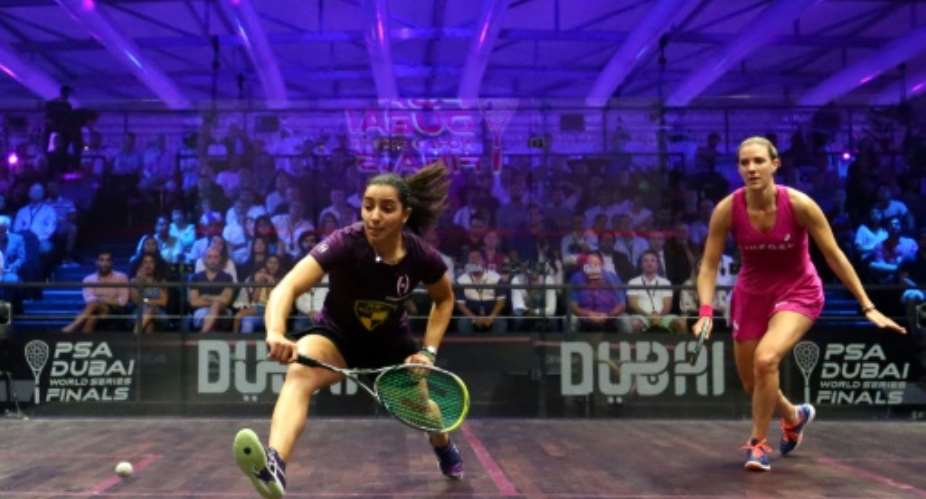 Raneem el-Welily of Egypt L plays a backhand to Laura Massaro of Great Britian in the final match of the Dubai PSA World Series Finals squash tournament in Dubai, May 28, 2016.  By MARWAN NAAMANI AFPFile