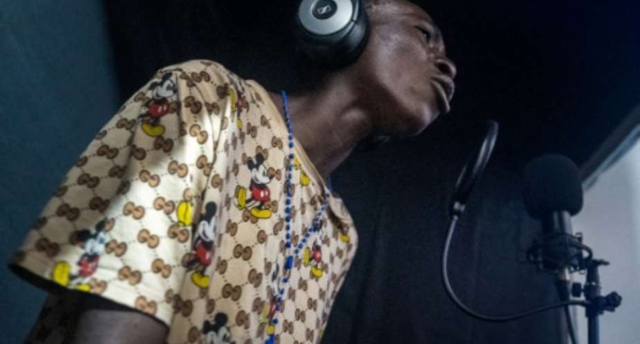 Rapper: Homeless teenager Business finds solace and a possible future in music.  By EMMET LIVINGSTONE (AFP)