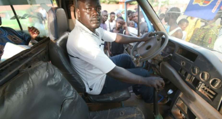 Ready to go: Marcel Zouh, a bus driver in Daloa, says he would emigrate to Europe at the drop of a hat.  By Sia KAMBOU AFP