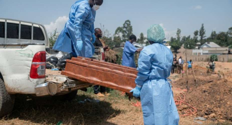 Red Cross personnel have conducted safe and dignified burials of Ebola victims.  By Jospin Mwisha (AFP)