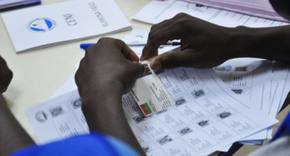 An election official works at a polling station in Ouagadougou during legislative and municipal elections on December 2, 2012.  By Ahmed Ouoba AFPFile