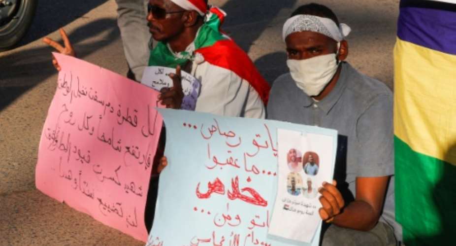 Relatives of protesters slain in demonstrations against the former regime hold a rally for justice in Khartoum in January 2021.  By ASHRAF SHAZLY AFPFile