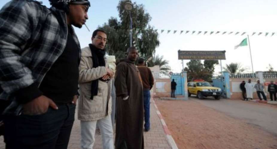 Algerians gather outside a hospital in In Amenas on January 19, 2013.  By Farouk Batiche (AFP)