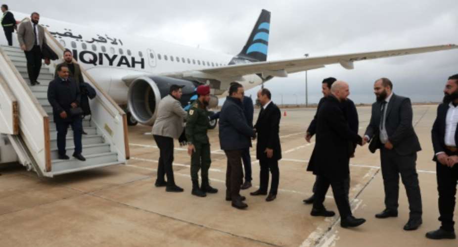 Representatives of Syrias new administration welcome the Libyan delegation to Damascus.  By OMAR HAJ KADOUR (AFP)