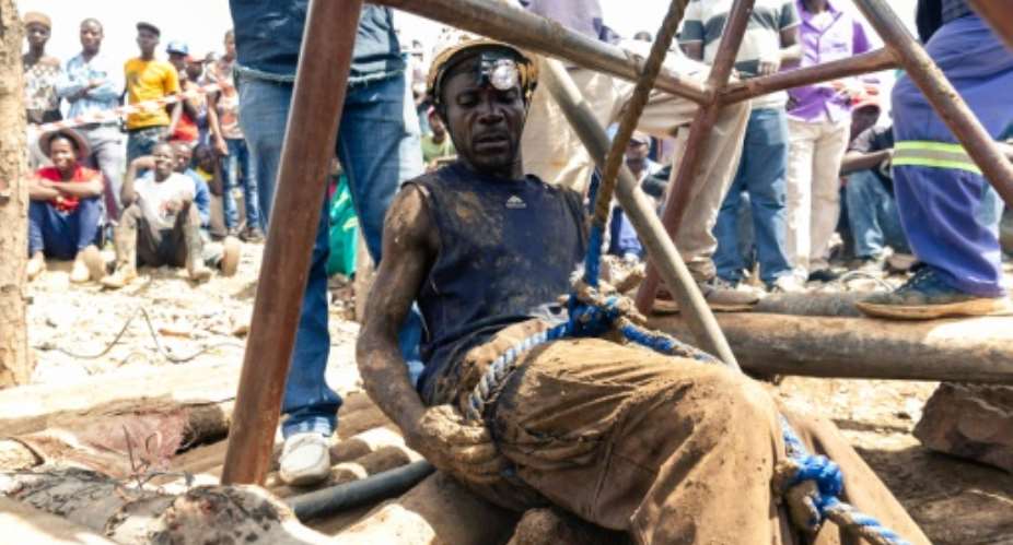 Rescue workers are still trying to save more miners trapped by flooding at the mine in Kadoma, Zimbabwe.  By Jekesai NJIKIZANA AFP