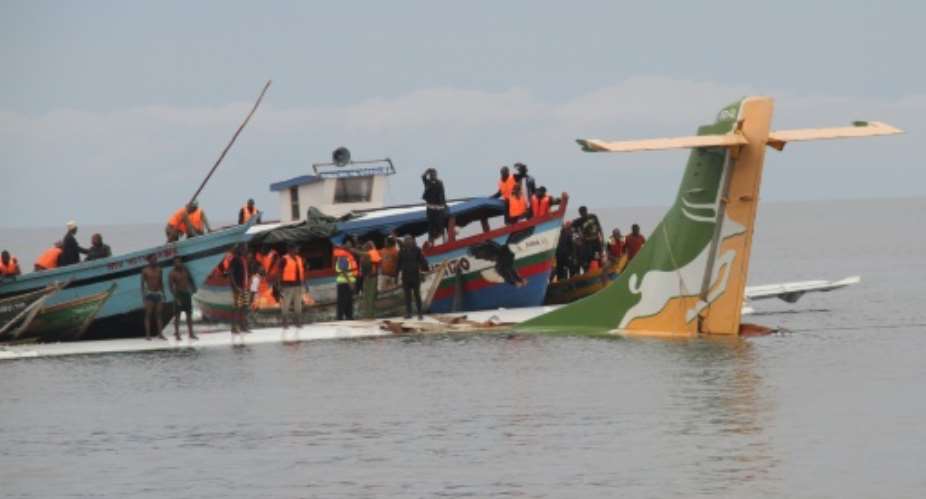 Rescuers searched for survivors after the Precision Air flight plunged into Lake Victoria with 43 people on board.  By SITIDE PROTASE AFP