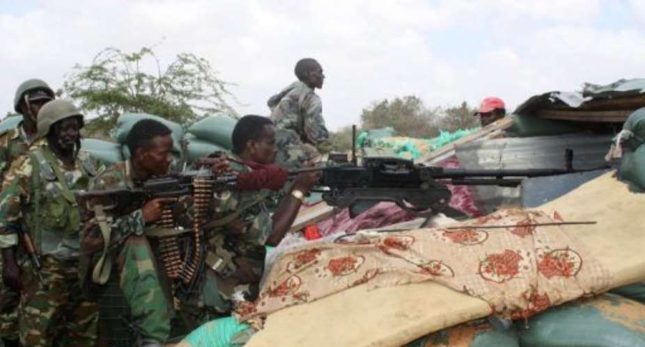 Somali military forces with African Union peacekeeping forces shoot at frontline of Deynille district.  By Abdurashid Abdulle Abikar AFPFile