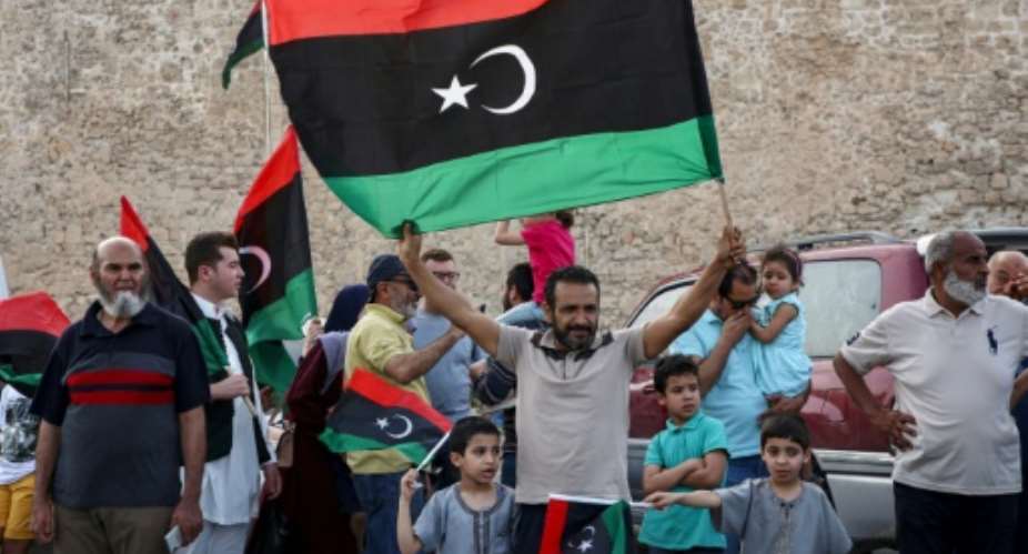 Residents of Tripoli celebrate after Libya's UN-recognised unity government announces it is back in full control of the capital and its suburbs.  By Mahmud TURKIA AFP