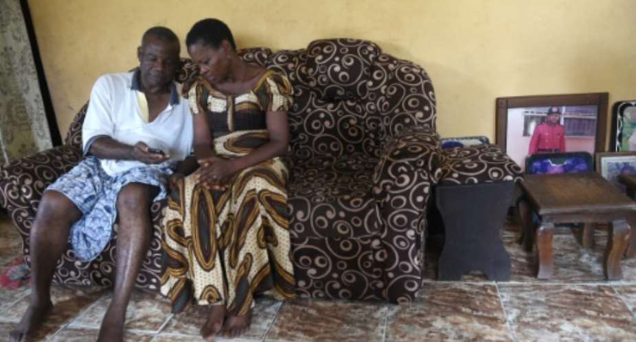 Retired civil servant Sunday Otoide and his wife Grace get financial help from two of their children who have been smuggled into Italy.  By PIUS UTOMI EKPEI AFP