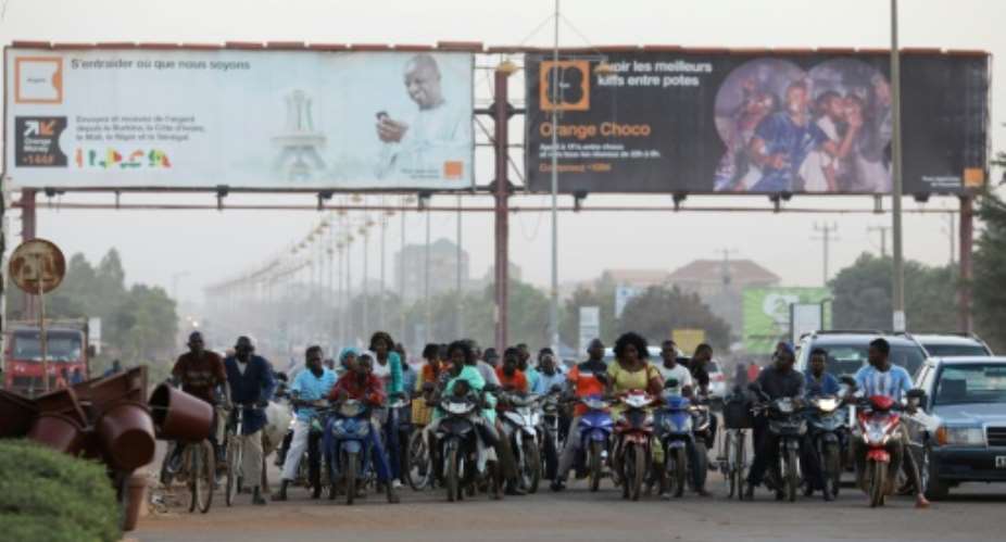 Riding motorbikes and bicycles is very popular in Burkina Faso.  By LUDOVIC MARIN AFPFile