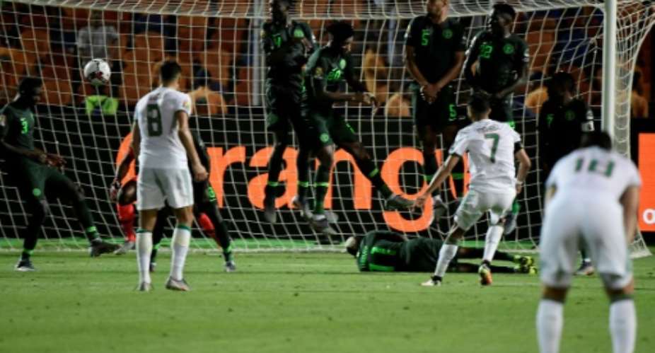Riyad Mahrez's 95th-minute free-kick knocked Nigeria out in the Africa Cup of Nations semi-finals.  By JAVIER SORIANO AFP