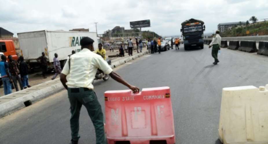 Road block: Lagos, Africa's biggest city, has been in lockdown since March 31.  By PIUS UTOMI EKPEI AFPFile