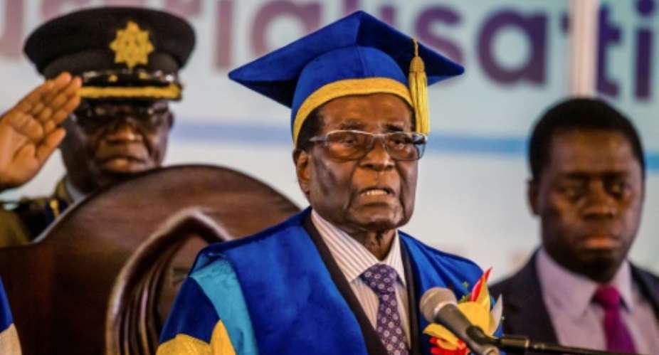 Robert Mugabe delivers a speech during a graduation ceremony at the Zimbabwe Open University in Harare on Friday, his first public appearance since the military takeover.  By - AFP