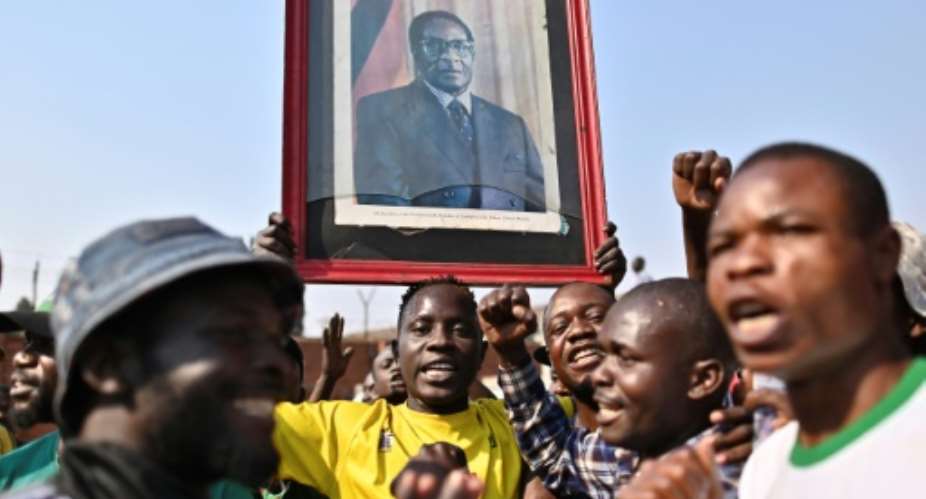 Robert Mugabe's death has left Zimbabweans torn over the legacy of the anti-colonial guerrilla hero whose iron-fisted rule ended in a coup in 2017.  By TONY KARUMBA AFP