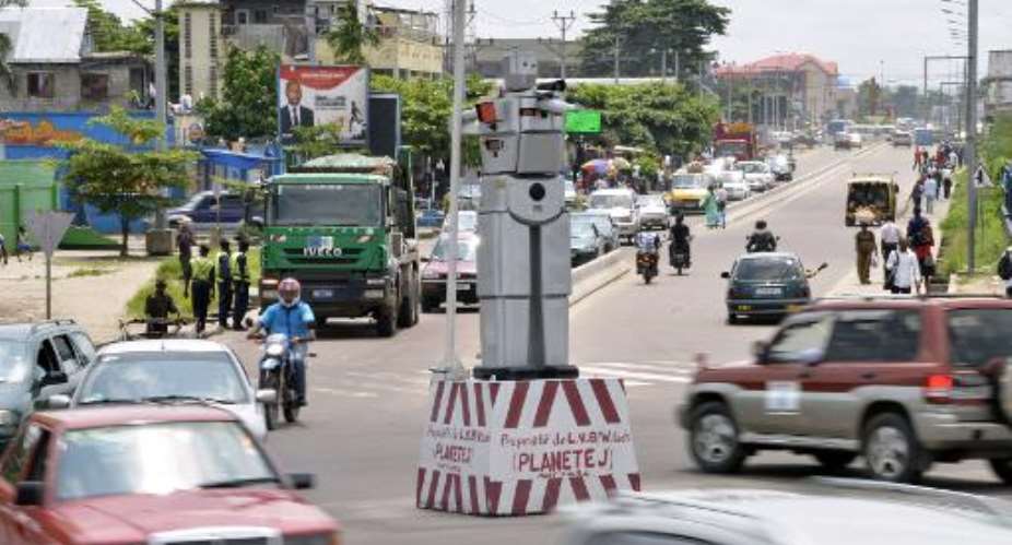 A robot cop on Triomphal boulevard of Kinshasa controls traffic on January 22, 2014.  By Junior D. Kannah AFPFile