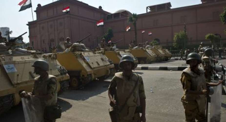 Egyptian soldiers stand guard outside Tahrir Square in Cairo, on October 6, 2013.  By Khaled Desouki AFPFile