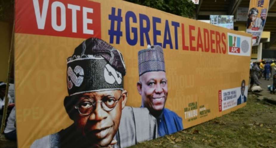 Ruling party candidate Bola Tinubu, seen here left with running mate Kashim Shettima, is ahead in a contested tally of the vote.  By PIUS UTOMI EKPEI AFP
