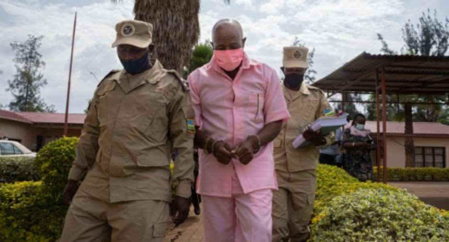Rusesabagina, wearing a pink prison uniform, pictured at his court appearance last October.  By Simon Wohlfahrt AFPFile