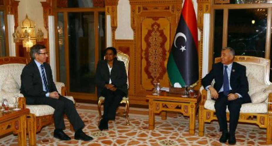 United Nations special envoy Bernardino Leon L meets with President of the General National Congress Nuri Abu Sahmein R in Tripoli on March 24, 2015.  By Mahmud Turkia AFPFile