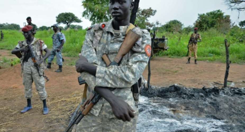 South Sudanese SPLA soldiers are pictured in Pageri in Eastern Equatoria state on August 20, 2015.  By Samir Bol AFP