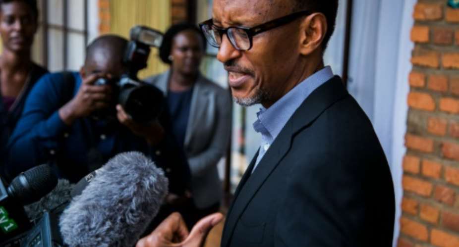 Rwandan President Paul Kagame speaks to journalists after voting in Kigali on December 18,2015 in a referendum to amend the constitution allowing him to rule until 2034.  By Cyril Ndegeya AFP