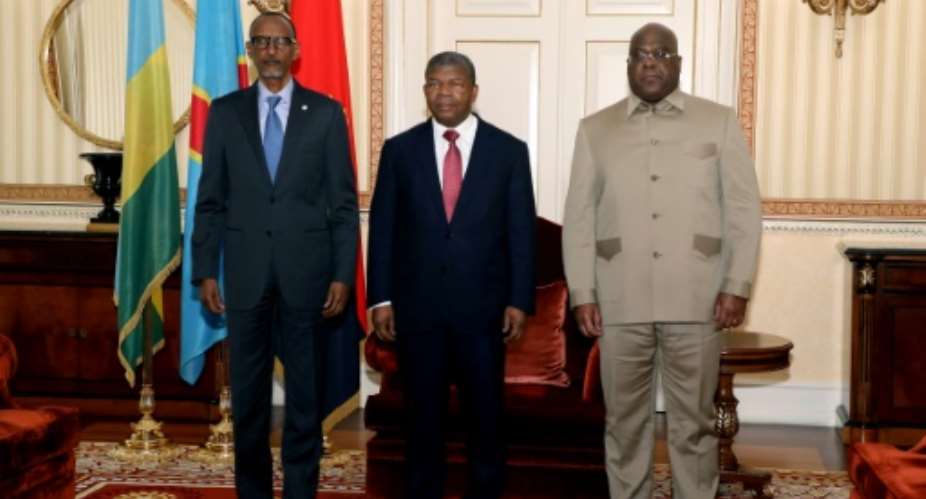 Rwanda President Paul Kagame L, Angola President Joao Lourenco C and Democratic Republic of Congo President Felix Tshisekedi R met for talks in Luanda on July 6, 2022, after a surge in violence in eastern DRC.  By Jorge NSIMBA AFP
