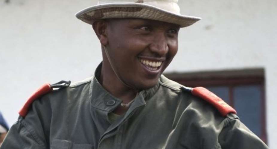 Bosco Ntaganda receives a Congolese army uniform during an integration ceremony in eastern DR Congo on January 29, 2009.  By Walter Astrada AFPFile