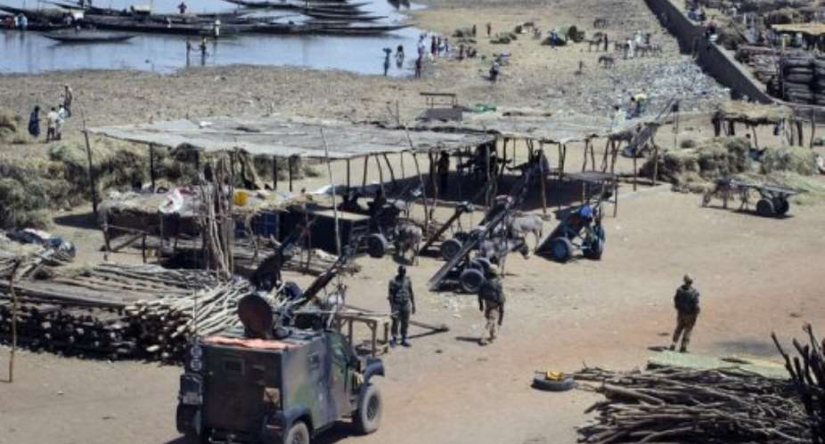 French soldiers patrol at Gaos port near the Niger river on April 4, 2013.  By Joel Saget (AFP/File)