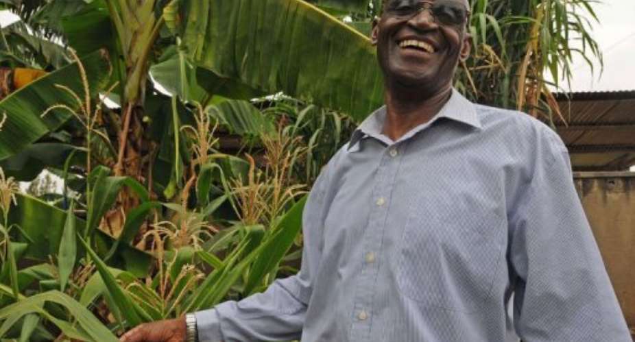 Rwandan former minister and opposition member, Charles Ntakirutinka, inspects the garden at his home upon his release.  By Steve Terrill (AFP)