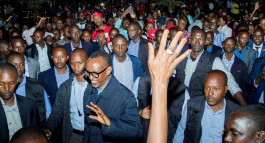 Rwandan President Paul Kagame C celebrated his reelection with supporters in Kigali on Saturday.  By CYRIL NDEGEYA AFP