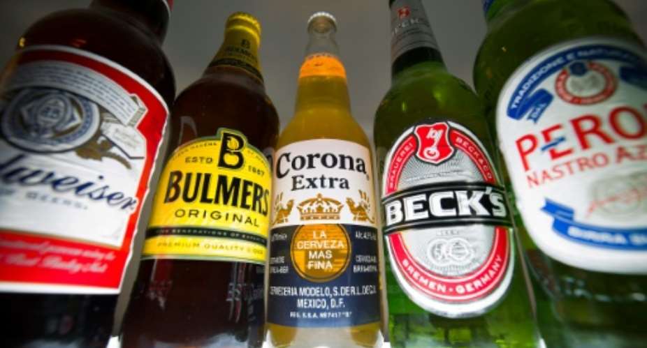 Bottles of beer and cider produced by InBev, Budweiser, Corona and Beck's and SABMiller Peroni and Bulmers.  By Justin Tallis AFPFile