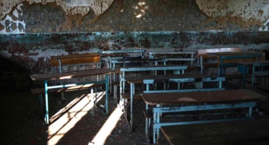 A school classroom torched by residents during protests in Vuwani, South Africa on May 8, 2016 over the redrawing of municipal boundaries ahead of local elections in the area.  By Mujahid Safodien AFPFile